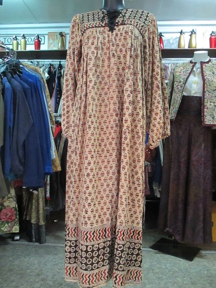 "Original 70s tunic. Made in India (pic.5). Hippy style. Boho fashion. Beige coloured with black and rust typical indian design. Round collar with braiding lace (pic.2). The long sleeves elastic is loose because of the passing time, but it's very easy to change it, if you want. Mint conditions. Size M Measurements: (lay flat and double chest) Shoulders 14.5\" chest 36.2\" sleeve length 23.6\" total length (from back neck bottom to hem) 52\". Vestito originale indiano anni 70. Made in India (foto Fall Bohemian Boho Print Dress, Long Sleeve Brown Bohemian Boho Dress, Bohemian Straight Kurta Kaftan For Festivals, Fall Festival Bohemian Boho Dress, Fall Festival Bohemian Dress, Festive Brown Bohemian Dress, Festive Bohemian Brown Dress, Traditional Boho Maxi Dress, Bohemian V-neck Kurta For Spring