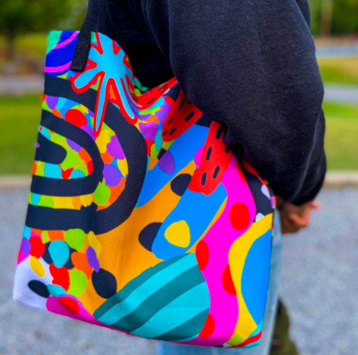 Embrace the rainbow with this stunning tote, a canvas of color for your daily journey! * 100% spun polyester fabric * Bag size: 15″ × 15″ (38.1 × 38.1 cm) * Capacity: 2.6 US gal (10 l) * Maximum weight limit: 44lbs (20 kg) * Dual handles made from 100% natural cotton bull denim * Handle length 11.8″ (30 cm), width 1″ (2.5 cm) * The handles can slightly differ depending on the fulfillment location * Blank product components sourced from China Colorful Tote Bags, Unique Tote Bag, Gift Totes, Trendy Tote Bags, Summer Bag, Bridal Party Gifts, Fabric Bag, Canvas Tote Bag, Gift Birthday