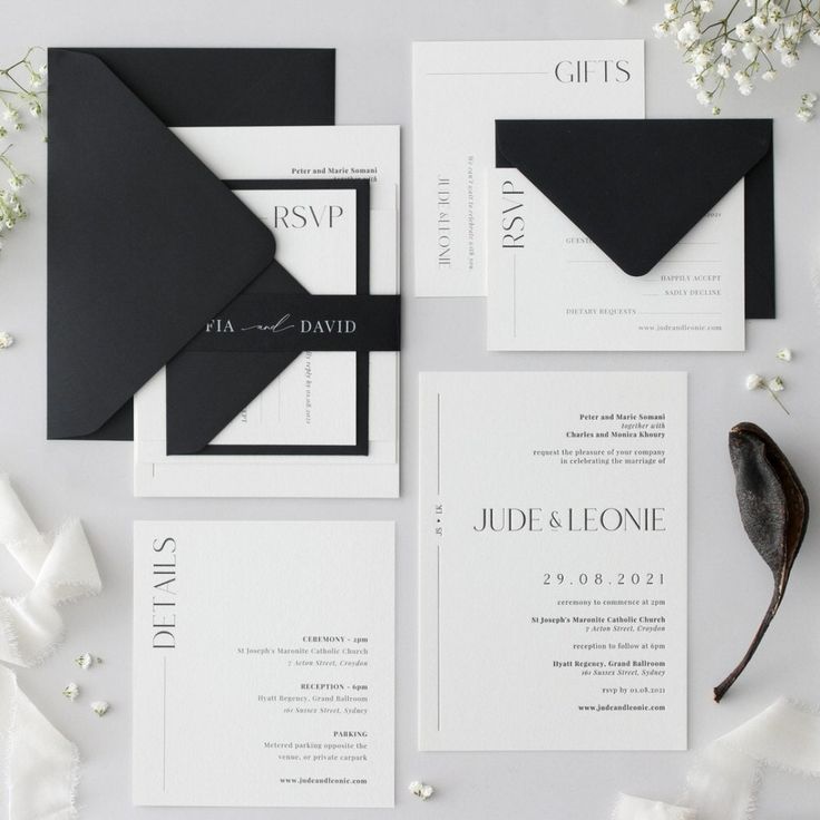 black and white wedding stationery with silver lettering