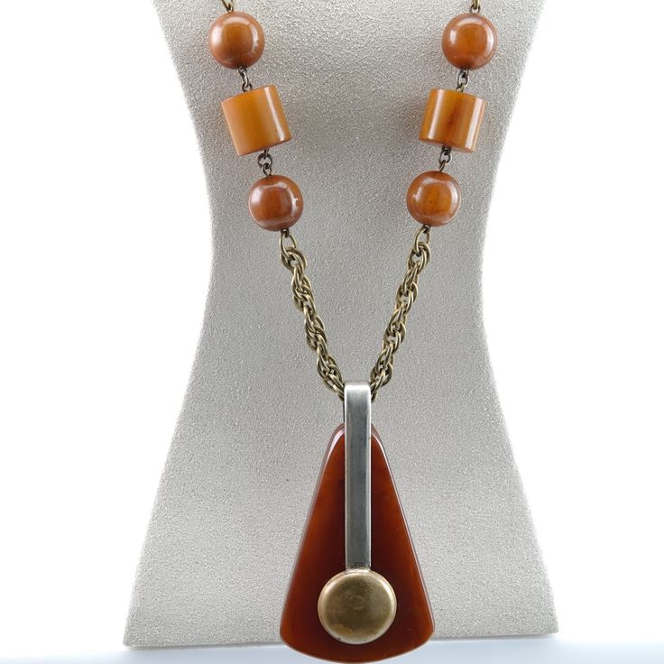 "1940's Period Art Deco Butterscotch Bakelite Necklace and Brass Mixed Metal Pendant. This is a great piece with a fantastic no brainer patina to both the bakelite and the brass chain/pendant. This is a great design that I'm sure can be attributed to someone but I don't have time to research things, though I'd be grateful for some input. The necklace is 26\" and the pendant hangs another 2 5/8\". This thing even looks great on me, it's a really classy period statement piece." Retro Bakelite Jewelry As Gift, Handmade Retro Bakelite Jewelry, Vintage Brown Necklace For Formal Occasions, Bakelite Necklace, Period Art, Handmade Pot, Vintage Studio, Be Grateful, Metal Pendant