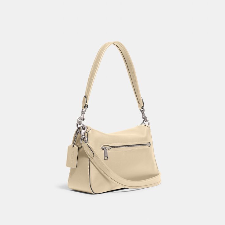 The Soft Tabby reimagines our structured take on an archival 1970s Coach design with a slouchy relaxed feel. Finished with our Signature hardware for an iconic touch this smooth leather shoulder bag features zip pockets inside and out to organize small accessories and two detachable straps to carry by hand style as a short shoulder bag or wear crossbody. | Coach Soft Tabby Shoulder Bag - Women's - Silver/ivory Coach Crossbody Hobo Bag With Zipper Closure, Classic Coach Crossbody Hobo Bag, Modern Coach Shoulder Bag In Soft Leather, Classic Coach Hobo Bag With Adjustable Strap, Coach Leather Hobo Bag With Zipper Closure, Coach Satchel Shoulder Bag With Zipper Pocket, Coach Satchel With Zipper Pocket For Everyday, Modern Coach Shoulder Bag With Zipper Pocket, Chic Coach Satchel With Zipper Closure