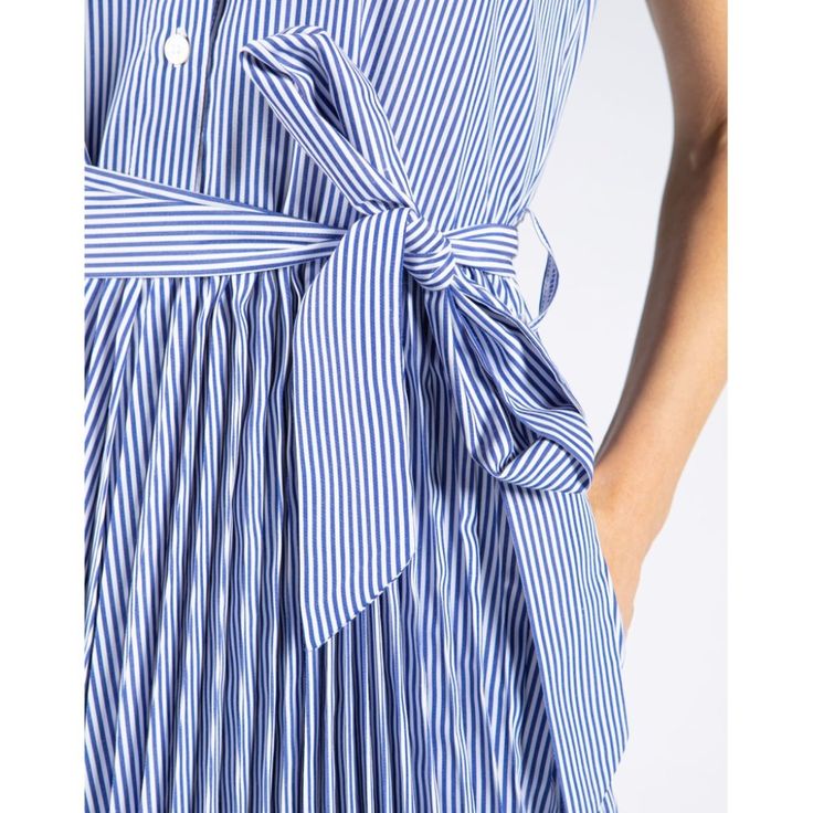 Tommy Hilfiger Women's Dress. Made Complete With Pockets And Cut In An Easy Fit, The Versatile Shirt Dress Is A Wardrobe Must. This Dress Is Sleeveless With An Airy Pleated Skirt For An Added Flare. Affordable Tommy Hilfiger Dresses For Women, Affordable Blue Dresses By Tommy Hilfiger, Tommy Hilfiger Summer Beach Dress, Vertical Stripes Shirt Dress For Daywear, Chic Summer Shirt Dress With Vertical Stripes, Summer Striped Pleated Dress, Tommy Hilfiger Summer Dress For Workwear, Tommy Hilfiger Dress For Summer Workwear, Striped Shirt Dress For Summer Workwear