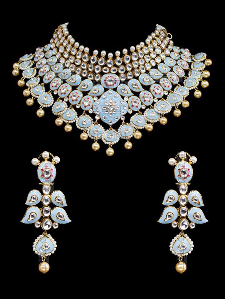 "Gulrukh Meenakari Bridal Set - Pastel Blue A pure hand-drawn detailed jewelry in the shades of soft pink and green meenakari work. This piece displays high-quality workmanship and fine usage of stones! This meenakari necklace set is perfect for western or traditional outfits. This set features a necklace with jadai detailing, featuring kundan chand motifs with lotus meenakari detailing. Delicate necklace accented with kundan stones and faux pearls creating a lush, sparkling set. The set include Blue Temple Jewelry With Round Shape, Blue Round Temple Jewelry, Elegant Blue Meenakari Necklace, Festive Cutdana Jewelry Gift, Festival Jewelry Gift With Cutdana Detail, Festival Jewelry Gift With Cutdana, Blue Kundan Jewelry For Formal Occasions, Blue Cutdana Necklace For Gift, Ceremonial Blue Enamel Jewelry