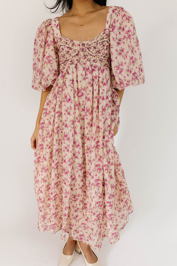 whether you’re searching for the perfect wedding guest dress, or for an excuse to feel like a princess, this puff sleeve midi dress does not disappoint. it features a stunning pink vintage floral pattern, dramatic puff sleeves, + a flirty corset-inspired bodice. the perfect long formal dress for garden parties, fancy dinners, + anytime you feel like frolicking. pink + purple floral // midi length, scoop neckline, dramatic puff sleeves, back zipper closure, smocked bodice, fully lined model is 5'8" + wearing a small measurements are approximate + taken while laying flat small : bust 31” (smocked) length 48” medium : bust 33” (smocked) length 49” large : bust 36" (smocked) length 49" xlarge : bust 38" (smocked) length 49" more fit + fabric info : polyester, cotton // fabric has no stretch (b Fancy Dinners, Perfect Wedding Guest Dress, Puff Sleeve Midi Dress, Long Formal Dress, French Floral, Feel Like A Princess, Vintage Floral Pattern, Fancy Dinner, Guest Dress