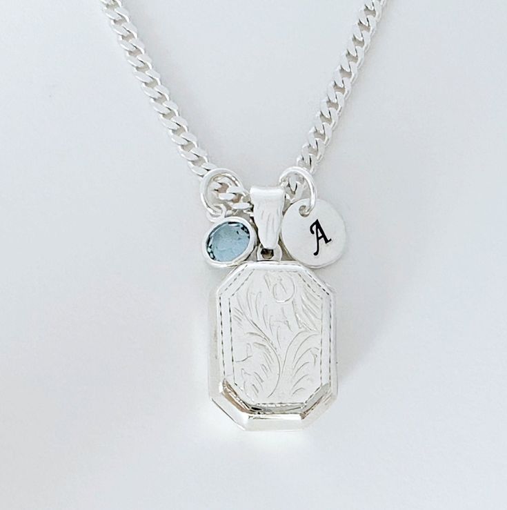 "Solid Sterling silver Locket Rectangle Necklace-  This piece will be a treasured keepsake! They're not only a trendy, stylish accessory, but also boast a rich and fascinating history.  This locket has a little bit of rim on both sides to hold two pictures in place without any glue!  The chains and Lockets I offer are solid 925 Sterling Silver Italy made, not silver or gold plated. . Take a look at other Locket designs: http://etsy.me/XKqYt8 . DESCRIPTION:  . Solid 925 Sterling silver Locket size:  20 mm L x 15 mm. . Sterling Silver disc 8mm with your chosen initial or heart 7mm upon request. . Swarovski birthstone of your choice month. . 925 Sterling Silver Italian Chains. I recommend curb chain for lockets!!   Need initials, charms, etc,? this link: http://etsy.me/UFmfXa . LOCKETS BY SHA Cheap Adjustable Silver Locket Necklace, Silver Charm Necklace With Detachable Pendant As Gift, Silver Etched Square Pendant Necklace, Silver Rectangular Etched Necklace, White Gold Rectangular Pendant For Wedding, Vintage Charm Rectangular Pendant Jewelry As Gift, Silver Sterling Charm Necklace With Detachable Pendant, Vintage Charm Rectangular Pendant Jewelry For Gift, Silver Charm Necklace With Detachable Pendant