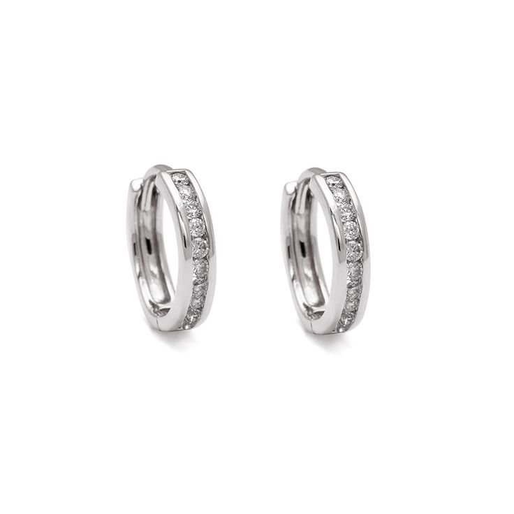 A pair of hoops with a line of grey diamonds set in sterling silver. Classic Silver Small Hoop Diamond Earrings, Classic Silver Channel Set Huggie Earrings, Classic Silver Huggie Earrings Channel Set, Classic Silver Huggie Earrings With Diamond Accents, Classic Silver Hoop Diamond Earrings, Timeless Silver Huggie Earrings For Anniversary, Silver Small Hoop Diamond Earrings For Anniversary, Silver Hoop Jewelry With Brilliant Cut, Silver Diamond Huggie Jewelry