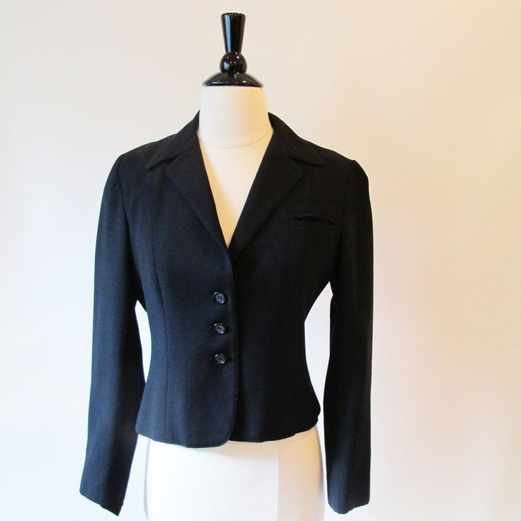 Black Blazer is fitted with a collar and front buttons., fully lined. Lovely style. From the 70's. Measurements with room for comfort Bust- up to 35 1/2 inches Waist- up to 29 inches Exact measurements taken flat to compare to a garment you own Length- 20 inches Sleeve length- 22 1/2 inches Shoulders across the back- 15 inches Bust- 18 1/2 inches Waist- 15 inches Condition- Excellent Dry Cleaned and ready to wear Brand / Designer- no labels to shop for more jackets- https://www.etsy.com/shop/Str Working Girl Office, 1940s Jacket, Girl Office, Black Wool Coat, Office Attire, Wool Dress, Brand Designer, Black Blazer, Wool Jacket