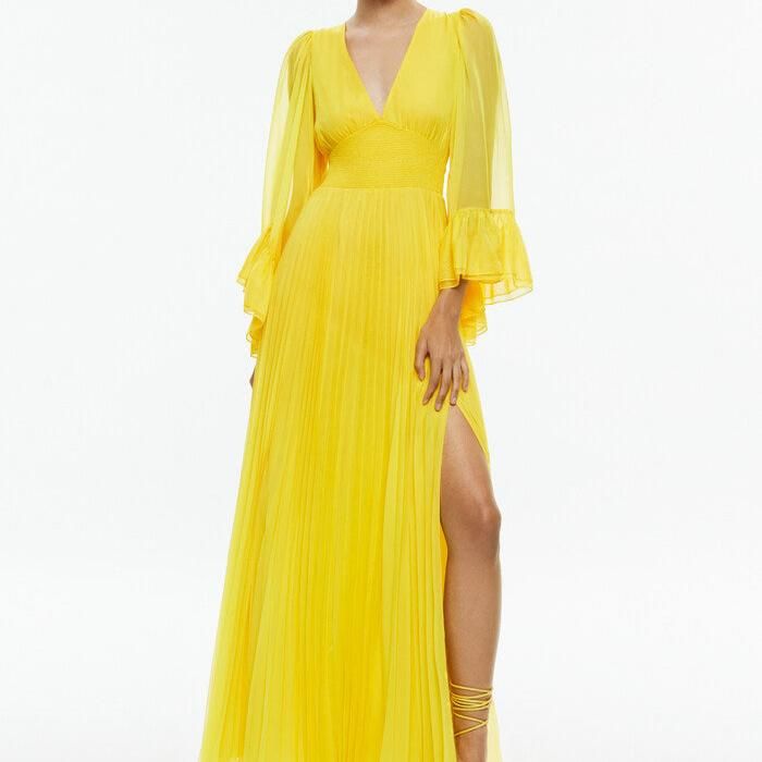 Selene is a romantic maxidress that features a deep V-neckline, pleating, a smocked waist for an adjustable fit and long, ruffled sleeves. In the happiest shade of yellow, she's basically wearable sunshine. Maxi dress V-neck Pleated Smocked waist Long sleeves with ruffled hems Exposed zipper back closure 100% polyester Dry clean only Imported Chiffon V-neck Pleated Maxi Dress, Spring Billowy Pleated Dresses, Billowy V-neck Maxi Dress With Gathered Sleeves, Billowy Ruched Maxi Dress For Spring, Spring Billowy Ruched Maxi Dress, Party Maxi Dress With Elastic Sleeves And V-neck, Flowy V-neck Maxi Dress With Pleated Bodice, Flowy V-neck Dress With Pleated Sleeves, Spring Evening Maxi Dress With Smocked Bodice