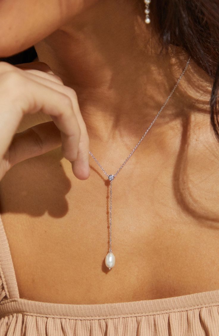 A timeless classic, this necklace is the epitome of everyday elegance. Crafted with a beautiful pearl, it's the perfect accessory that will never go out of style. Pearl Accessories, Dot Dot, Everyday Elegance, Y Necklace, Silver Pearls, Brass Color, Necklace Silver, Timeless Classic, Out Of Style