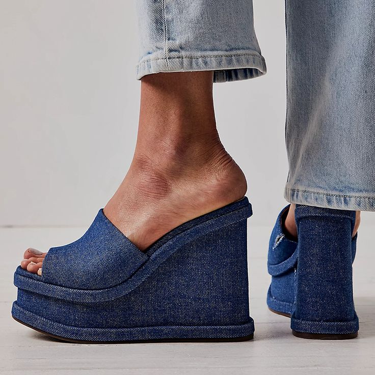 Step back in time with these Blue Denim Platform Mules. Vintage charm meets modern style in these open-toe wedge sandals, perfect for a touch of nostalgia with a contemporary twist. Color: Blue Material: Denim Heel Type: Wedge heel Heel height: 4.72" / 120 mm approx Product measurements were taken using size 8. Please note that measurements may vary by size. Toe: Open toe With platform Handcrafted US sizing. Fits true to size. High Heel Thong Sandals, Denim Mules, Cowboy Shoes, Denim Heels, Blue Wedges, Platform Mules, Boots Square Toe, Suede Boots Knee High, Wedge Heel Sandals