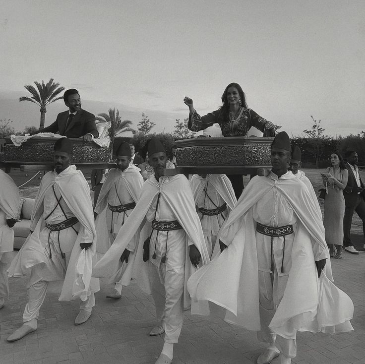 a group of people dressed in costume walking down a street