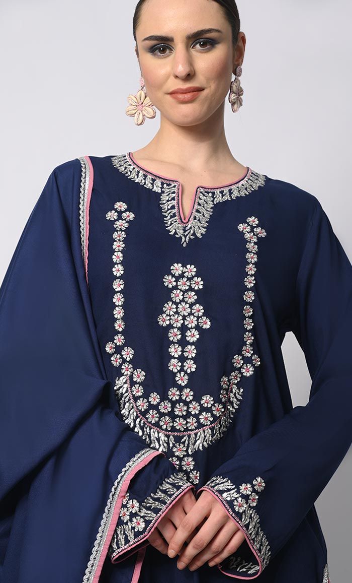 Introducing our enchanting 3-piece Salwar Kameez with Dupatta set, where traditional craftsmanship meets contemporary style. This set features stunning machine embroidery adorned with delicate sequins work, adding a touch of glamour and sophistication to your ensemble. Each piece is meticulously crafted to perfection, ensuring that every stitch and detail exudes elegance and charm. Whether you're attending a festive celebration or a formal event, this Salwar Kameez set promises to elevate your look with its timeless appeal and exquisite craftsmanship. Experience the epitome of luxury and grace with our 3-piece Salwar Kameez set, designed to make you shine on every occasion. Size & Fit Model height is 5’9’ and is wearing a Small sizeMaterial & CareMaterial: Rayon Care: Gentle machine wash i Eid Traditional Wear With Floral Embroidery On Georgette, Cambric Palazzo Set With Dabka Work, Eid Embroidered Georgette Sets, Festive Straight Kurta Palazzo Set For Traditional Ceremonies, Embroidered Semi-stitched Sets, Unstitched Embroidered Georgette Palazzo Set, Eid Semi-stitched Palazzo Set With Resham Embroidery, Resham Embroidered Sets For Eid, Traditional Straight Kurta Palazzo Set With Dabka Work