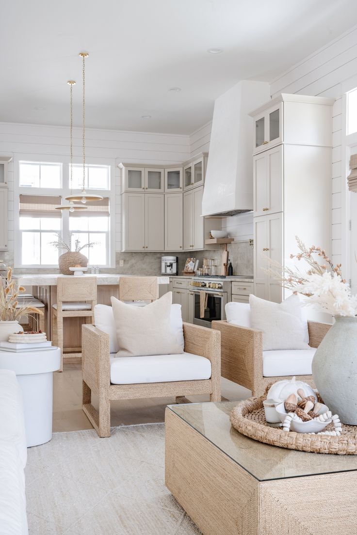 a living room filled with furniture and white walls