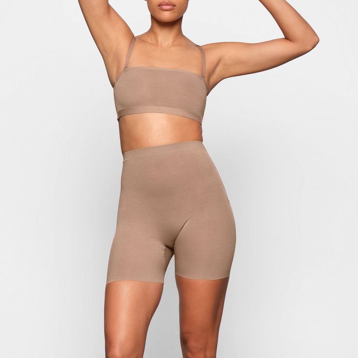 A mid-thigh short with deep low back that makes it perfect backless shapewear option for low cut clothing. Smooths and sculpts thighs and hips with silky smooth compression. | SKIMS Low Back Short | Medium Neutral | Sheer Sculpt Backless Shapewear, Mid Thigh Shorts, Low Back Dresses, Low Cut Dresses, Cut Clothes, Cami Bodysuit, Square Neck Bodysuit, High Waisted Briefs, Longline Bra