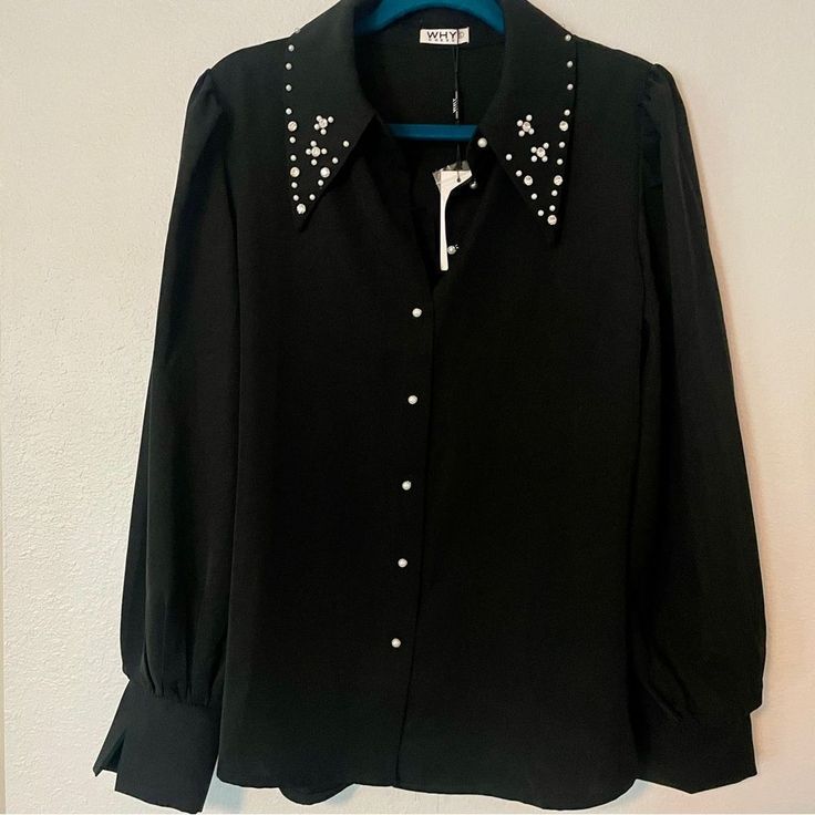 Black Button-Up Top. Festive Sparkle Embellishments Collar And Buttons. It’s So Fun And Versatile!! Channel Your Inner Elvis With Some Bell Bottoms And Boots Or Keep It Classic With A Maxi Skirt And Pumps. Black, Rhinestone, Pearls, Collar, Button Up. Size Large. Never Worn, Like New! No Tags. Colors May Vary Due To Lighting. Measurements Are Approximate. Embellished Button-up Workwear Blouse, Elegant Button-up Embellished Blouse, Elegant Embellished Button-up Blouse, Party Black Top With Embellished Collar, Black Party Top With Embellished Collar, Party Top With Embellished Collar In Black, Elegant Rhinestone Blouse For Parties, Elegant Party Blouse With Pearl Buttons, Black Long Sleeve Tops With Embellished Collar