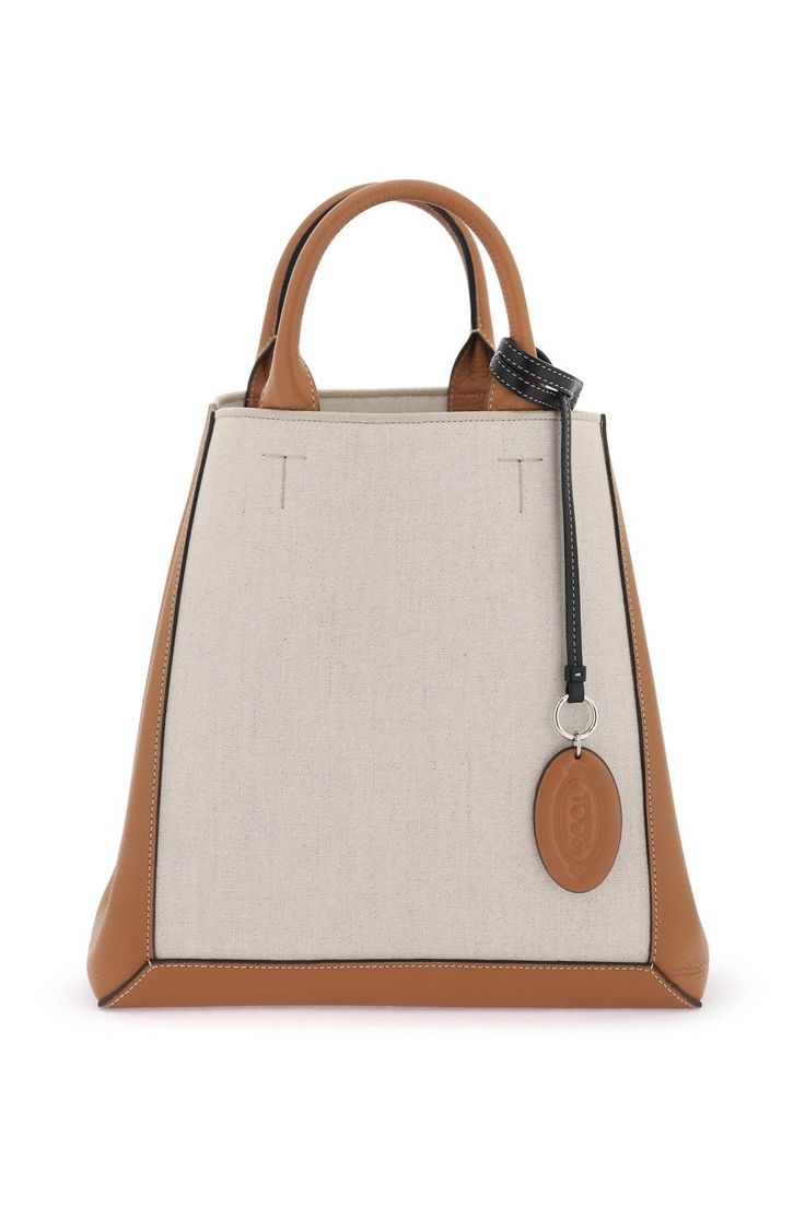 50% Linen, 50% Cotton Outside: 100% Leather Canvas Leather Tote Bag, Tods Bag, Canvas Leather Tote, Side Snap, Timeless Wardrobe Staples, Small Tote Bag, Linen Canvas, Metal Accessories, Work Style