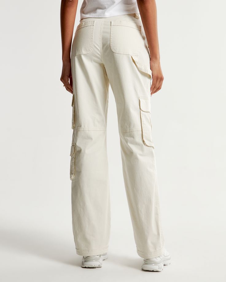 Easy-fitting high rise pants in a soft twill fabric and relaxed-fit silhouette, featuring cargo-inspired details, pockets and functional fly closure. Spring Cargo Pants With Patch Pockets, Straight Leg Cargo Parachute Pants For Spring, Spring Straight Leg Parachute Pants Cargo Style, High Rise Relaxed Fit Parachute Pants With Pockets, Spring Straight Leg Cargo Pants With Hip Pockets, Relaxed Fit Mid-rise Parachute Pants With Pockets, High Waist Cotton Parachute Pants With Flap Pockets, Full-length Spring Cargo Pants, Cotton Parachute Pants With Flap Pockets And Straight Leg