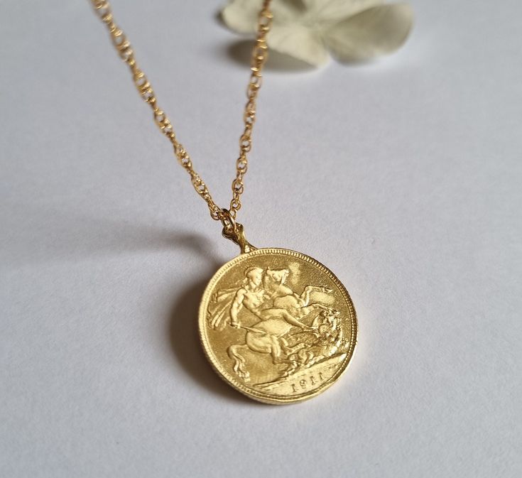 This gold coin necklace was handmade using an old gold Moroccan coin an acquainted of mine inherited from her mother.  The pendant can be used on both sides. See last photo for the back side of the coin. The necklace is a quality 14k gold filled chain. The coin pendant necklace is also available in sterling silver. Dimensions: The old Moroccan coin pendant's diameter is 2.1 cm (0.8 inches) The 14k gold necklace is available in multiple lengths.  This Gold coin necklace is delicate, unique and be Yellow Gold Medallion Coin Necklace In Brass, Vintage Yellow Gold Brass Coin Necklace, Vintage Yellow Gold Jewelry With Coin Pendant, Antique Brass Coin Necklace With Round Pendant, Vintage 14k Gold Coin Pendant Jewelry, Vintage Yellow Gold Round Coin Necklace, Antique Round Coin Necklace, Antique Engraved Yellow Gold Coin Necklace, Heirloom Brass Necklace With Coin Pendant