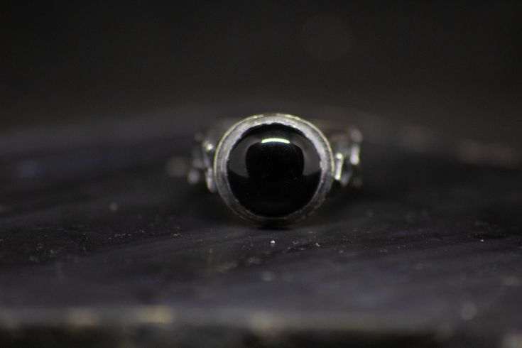 "Archangel ring. // Black onyx, sterling silver. Features the sigils of the archangels Raphael, Michael, Gabriel, and Uriel, set with a 12mm black onyx. The word archangel derives from the Greek ἀρχάγγελος, meaning \"chief angel\", or \"angel of origin.\" The archangel Michael appears in the Bible depicted as having \"the voice of the archangel, with the trumpet call of God\" and is referred to as one of the \"chief princes\". Personified as angels to man, they are the first executors of the div Black Sterling Silver Hand Forged Jewelry, Black Hand Forged Sterling Silver Jewelry, Hand Forged Black Sterling Silver Jewelry, Formal Black Hand Forged Jewelry, Formal Hand Forged Black Jewelry, Mystical Black Sterling Silver Rings, Minimalist Hand Forged Black Rings, Hand Forged Black Rings, Archangels Raphael