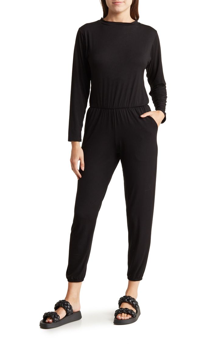 Go casual in this one-and-done jumpsuit fashioned with an elastic blouson waist and cinched elastic hems. Crewneck Long sleeves 90% modal, 10% spandex Hand wash, dry flat Made in the USA of imported fabric Model stats: 5'10" height, 32" bust, 25" waist, 36" hip. Model is wearing size Small. Stretch Jumpsuits And Rompers With Elastic Waistband, Versatile Stretch Jumpsuits And Rompers For Work, Fitted Casual Jumpsuits With Elastic Waistband, Casual Fitted Jumpsuits With Elastic Waistband, Casual Spring Jumpsuits And Rompers, Black Elastane Jumpsuits And Rompers For Loungewear, Black Jumpsuits And Rompers With Elastic Waistband For Work, Stretch Solid Jumpsuits And Rompers With Elastic Waistband, Casual Stretch Jumpsuits And Rompers For Work