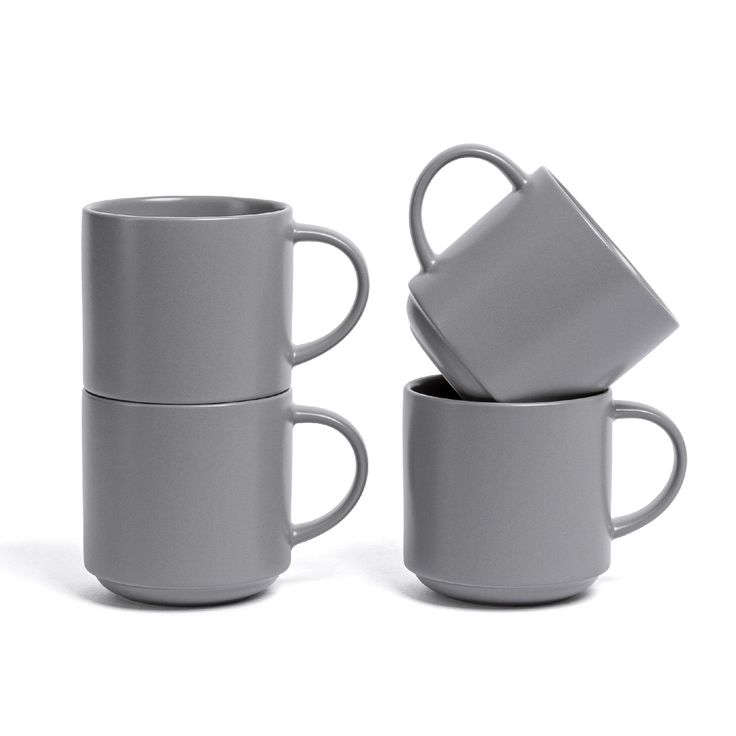 three grey coffee mugs stacked on top of each other with one cup in the middle