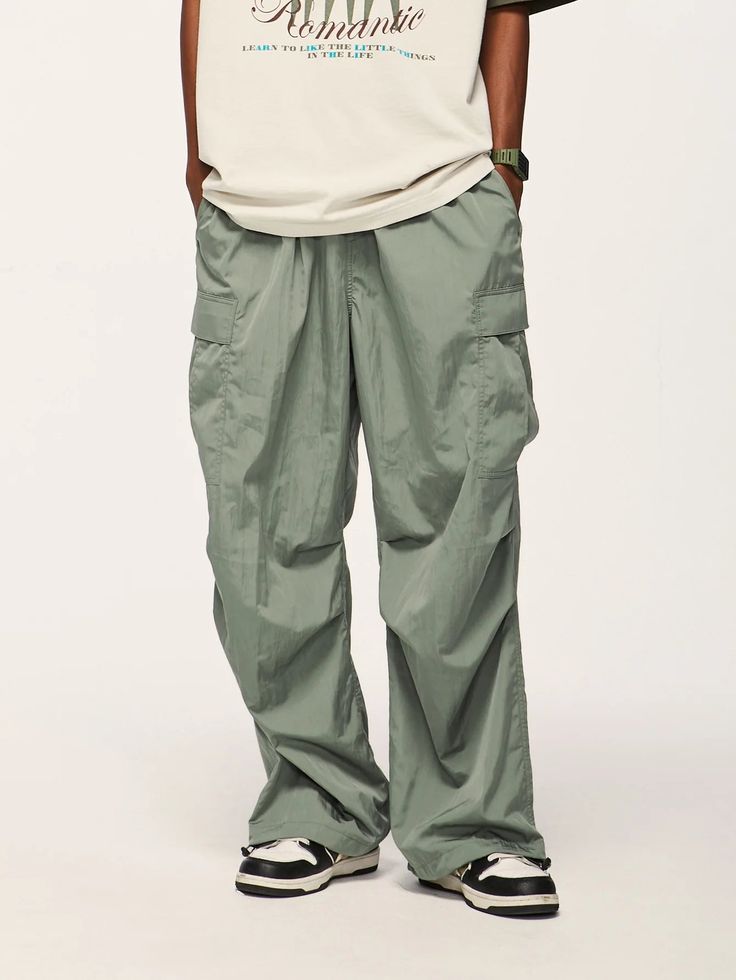 Elevate your streetwear with our Jet Cargo Pant. Vintage-inspired design, made from polyester and nylon, featuring midweight fabric and drawstring closure. SPECIFICATIONS Material: Polyester, Nylon Thickness: Midweight Waist Type: Mid Decoration: Pockets Closure Type: Drawstring Fabric Type: Broadcloth Nylon Techwear Pants With Functional Drawstring, Urban Parachute Pants For Outdoor, Techwear Nylon Cargo Pants For Outdoor Activities, Nylon Techwear Parachute Pants With Functional Drawstring, Utility Nylon Pants With Functional Drawstring, Nylon Techwear Cargo Pants For Outdoor, Green Athleisure Cargo Pants For Outdoor Activities, Green Athleisure Cargo Pants For Outdoor, Nylon Parachute Pants With Functional Drawstring For Outdoor