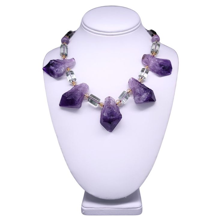 Unique Radiance: Discover the unparalleled beauty of our One-of-a-Kind Necklace—a fusion of bold design and comfort. Crafted with meticulous attention to detail, this extraordinary piece features a boldly cut, flat-back Purple Amethyst, providing both elegance and comfort against the skin. Interspersed throughout are Green Amethyst spacers in a chic cylinder shape, known as Prasiolite, creating a captivating contrast. Small Vermeil spacers delicately punctuate the arrangement, adding a touch of Cylinder Shape, Creating Jewelry, Amethyst Necklace, Hand Jewelry, John Galliano, Green Amethyst, Bold Design, Donna Karan, Unique Necklaces