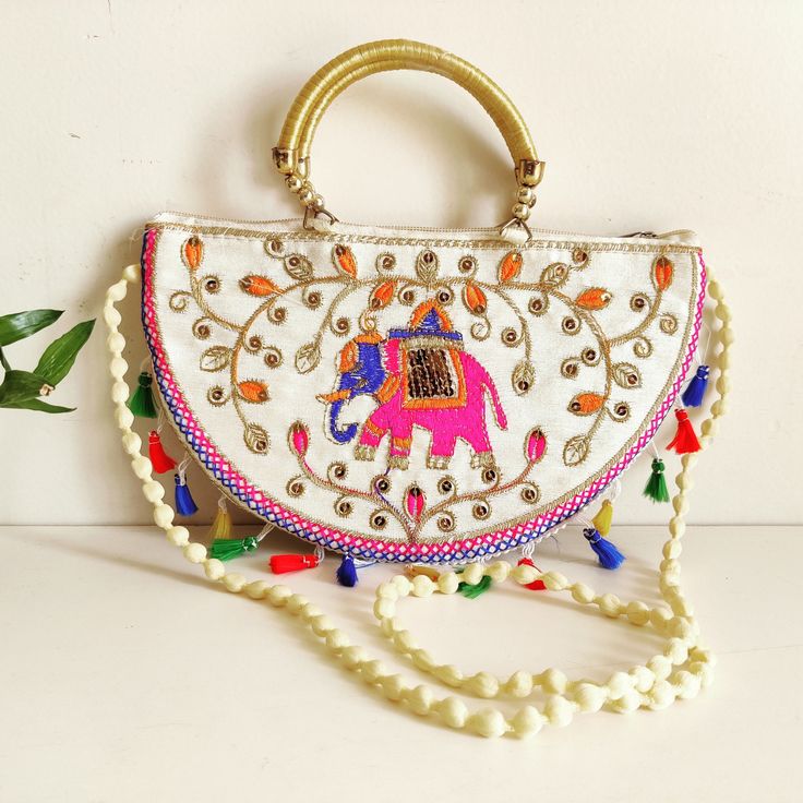 Cotton Traditional Ethnic Rajasthani Jaipuri Embroidered Elephant Handbag | Sling Bag for Girls/Women | Indian Sling Bag | Ethnic Purse. This stylish Shoulder Bag Makes your appearance a more elegant. Good Quality Double Handle Well Finished Thread Work. Ideal for women and girls, specially designed to carry in parties and weddings. Carry this Rajasthani Jaipuri handbag with any traditional or casual attire. It will complete and Enhance your look perfectly. Great addition to your collection. Siz Traditional Handheld Bag With Multicolor Embroidery, Traditional Multicolor Embroidered Handheld Bag, Traditional Multicolor Embroidered Bag For Daily Use, Multicolor Potli Bag For Daily Use, Daily Use Multicolor Potli Bag, Festive Embroidered Handheld Shoulder Bag, Festive Multicolor Handheld Bag, Festive Multicolor Handheld Bags, Festive White Handmade Bag