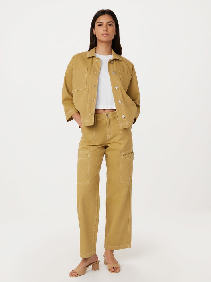 The Annie pants feature a loose fit, mid-rise, and full-length legs. Loose through the hips. Straight from knee to leg opening. Welt cargo-inspired pockets on the sides with contrast utility topstitches. Two slash pockets. Patch pockets at the back. Shank button at the front closure. Inseam: 31.5". Made with a blend of Utility Wide-leg Work Pants, Utility Work Pants With Patch Pockets For Spring, Relaxed Fit Cargo Pants For Work, Fall Workwear Bottoms With Multiple Pockets, Spring Utility Cargo Pants, Spring Utility Work Pants With Pockets, Fall Cargo Pocket Pants With Straight Hem, Utility Work Pants With Pockets For Spring, Wide-leg Cargo Jeans With Multiple Pockets For Work