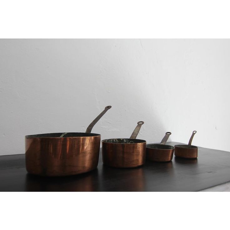 A set of 4 early 20th century French copper pots.   Unrestored original condition, lined with tin, handle made of wrought iron, pot made of unalloyed sheet copper.   Copper has been used and valued by humans for around 9000 years. The material was originally shaped with a hammer. from the beginning of the 20th century until the 1960s, the copper sheet was formed by hand on a spinning bench before machine production began in the 1960s.  Pots made of copper are excellent heat conductors, the mater Rosewood Kitchen, Green Kitchen Accessories, Copper Kitchen Accessories, Pots Set, Modern Kitchen Accessories, Copper Utensils, French Kitchen, Copper Sheets, Copper Pots