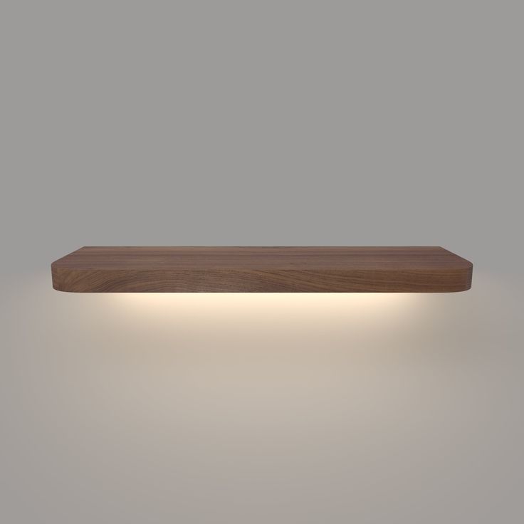 a wooden shelf with lights above it