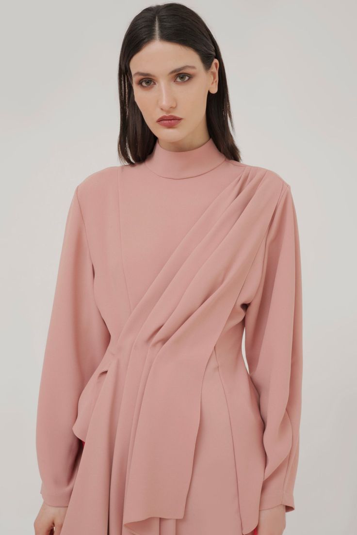 Rich and romantic are two words that best describe Dalood’s Fall '20 collection and this top certainly ticks both boxes. It's tailored with a draped detailing and silhouette with a stretch crepe fabric. Take style cues from the label and layer yours with a pair of trousers from this season -- Product Details Compositio Luxury Embroidered Draped Blouse Piece, Luxury Summer Blouse With Draped Sleeves, Luxury Silk Embroidered Top With Traditional Drape, Luxury Draped Workwear Tops, Luxury Pink Tops With Traditional Drape, Elegant Luxury Tops With Cutdana Details, Luxury Tops With Draped Sleeves For Spring, Luxury Embroidered Women's Top With Traditional Drape, Luxury White Draped Blouse