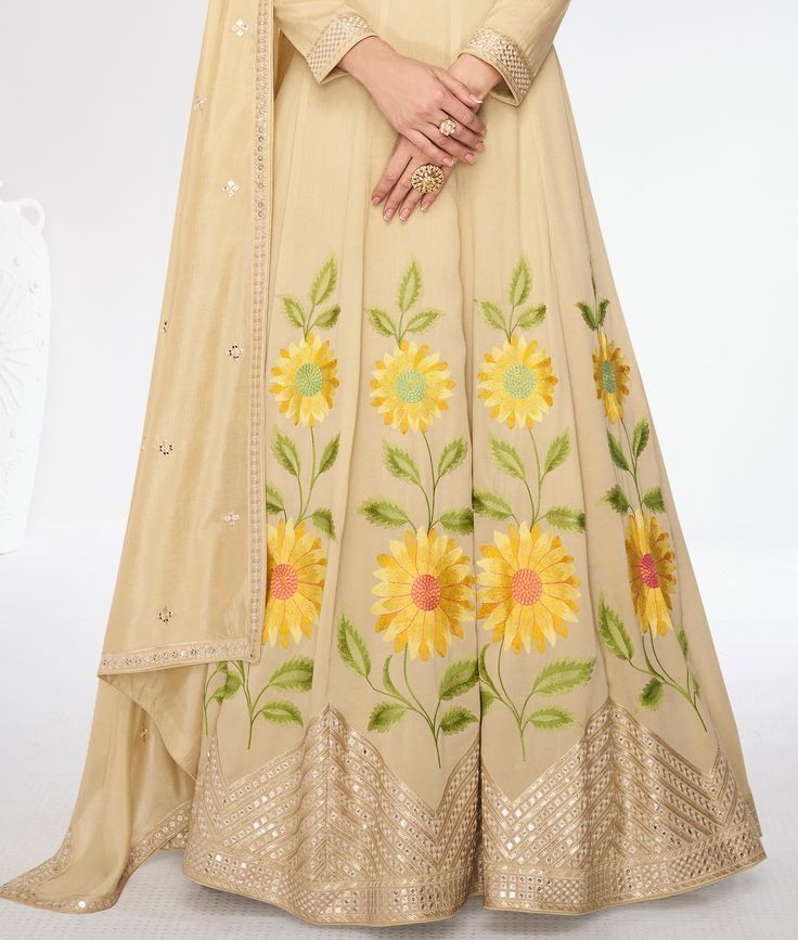 COLOR : Dull Yellow Cream FABRIC : Gown & Dupatta - Premium Silk WORK : Resham Embroidery, Hand Work, Sequins, Floral Motifs, Lace Border OCCASION : Wedding, Reception, Mehendi, Party Wear, Festival READY-TO-WEAR : No STITCHING : Available as semi-stitched fabric, can be stitched using standard size option (+$30). Note: There might be a slight color variation due to lighting and flash used during photoshoot. The bright shade seen is the best closer view of fabric's color. Georgette Dress With Multicolor Embroidery And Dabka Work, Semi-stitched Multicolor Embroidered Dress For Reception, Multicolor Embroidered Anarkali Set For Wedding, Maxi Length Salwar Kameez With Intricate Embroidery For Navratri, Multicolor Embroidered Semi-stitched Dress For Reception, Anarkali Dress With Multicolor Embroidery For Wedding, Floor-length Embroidered Art Silk Sets, Floor-length Gown With Dori Work For Diwali, Fitted Dress With Multicolor Embroidery For Diwali