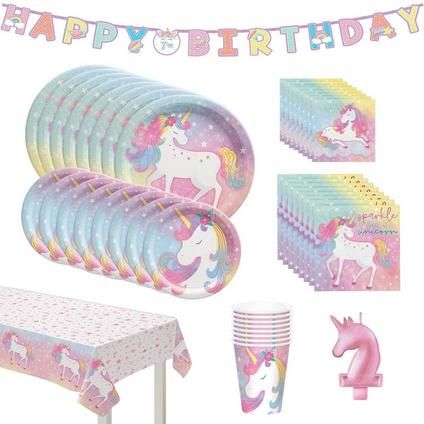 a birthday party set up with unicorns and rainbow paper plates, cups and napkins