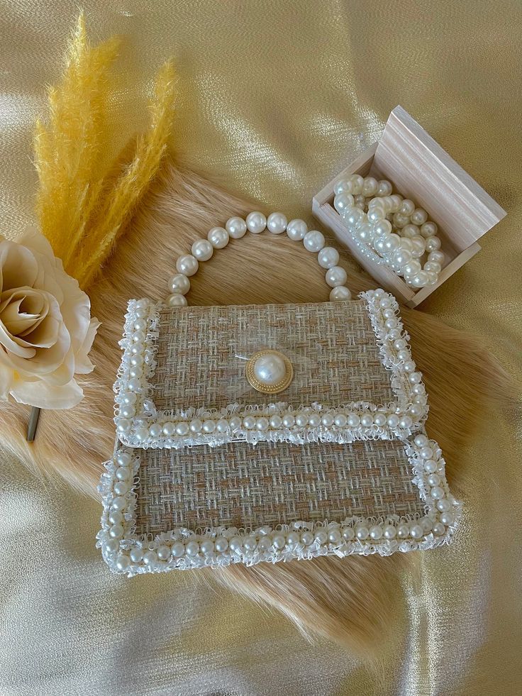 Pearl hand bags. Handmade from the Philippines. Beige Box Bag With Top Carry Handle For Gift, Beige Box Bag With Top Carry Handle As Gift, Beige Box Bag With Top Carry Handle, Beige Box Bag With Top Handle As Gift, Cream Rectangular Box Bag For Gifts, Beige Rectangular Box Bag For Gifting, Rectangular Cream Box Bag For Gift, Rectangular Cream Box Bag For Gifts, Rectangular Beige Box Bag For Gifts