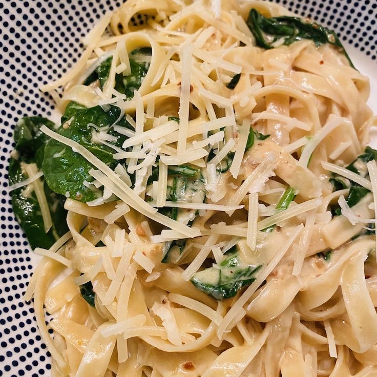 pasta with spinach and cheese on a plate