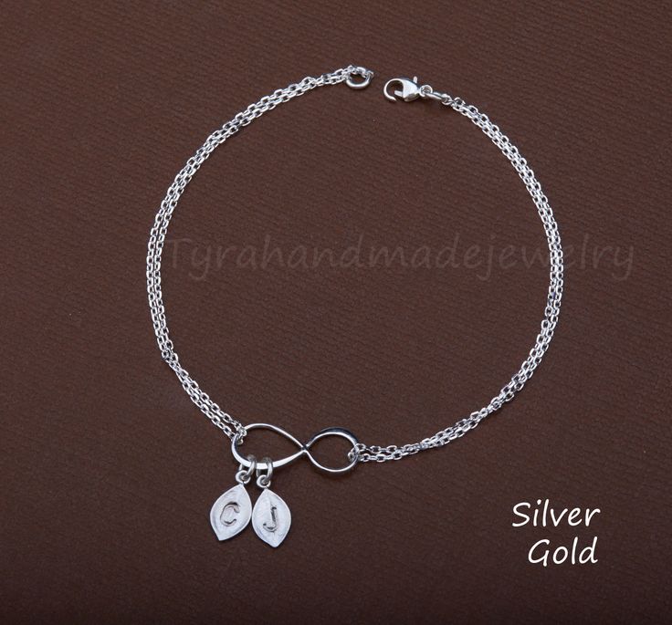 A perfect gift for a mother or a best friend, this infinity initial bracelet has two metal/color options: 1. a sterling silver or 24k gold vermail infinity charm (3/4 inch) 2. optional matte silver or gold plated leaf charms, each stamped with an initial (can be black-filled or left as stamped) 3. a sterling silver or 14k gold filled double chains closed with a lobster clasp 4. an optional personalized jewelry card, printed with your own, customized message on heavy weight cardstock, in elegant Mother Bracelet, Family Bracelets, Monogram Bracelet, Mothers Bracelet, Infinity Charm, Sterling Silver Locket, Infinity Jewelry, Leaf Bracelet, Nana Gifts