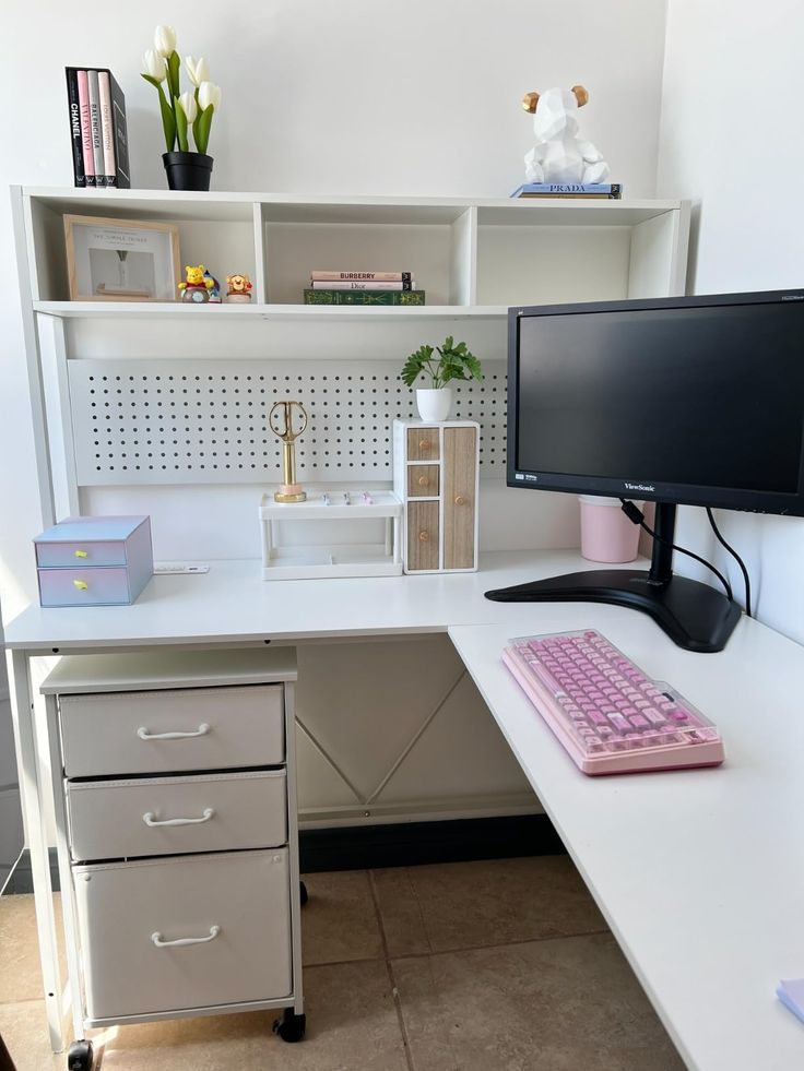 a computer desk with a keyboard, monitor and mouse sitting on it's side