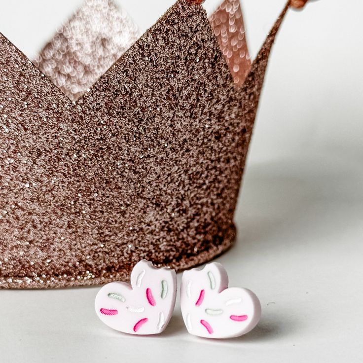 These irresistible sugar cookies with pink frosting make great Valentine's Day earrings! Crafted from wood and acrylic, each earring features a delightful bite and sprinkles on top. Perfect for cookie enthusiasts or a romantic touch on Valentine's Day, these earrings measure approximately 2" in length and 1.5" in width. Handmade Sweet Heart Earrings, Cute Pink Heart Earrings For Birthday, Cute Pink Heart Earrings For Mother's Day, Sweet White Heart Earrings, Sweet Heart Earrings For Valentine's Day, Playful Pink Heart Earrings For Valentine's Day, Playful Pink Heart Earrings For Gift, Sweet Pink Heart-shaped Earrings, Playful Pink Heart Earrings As Gift