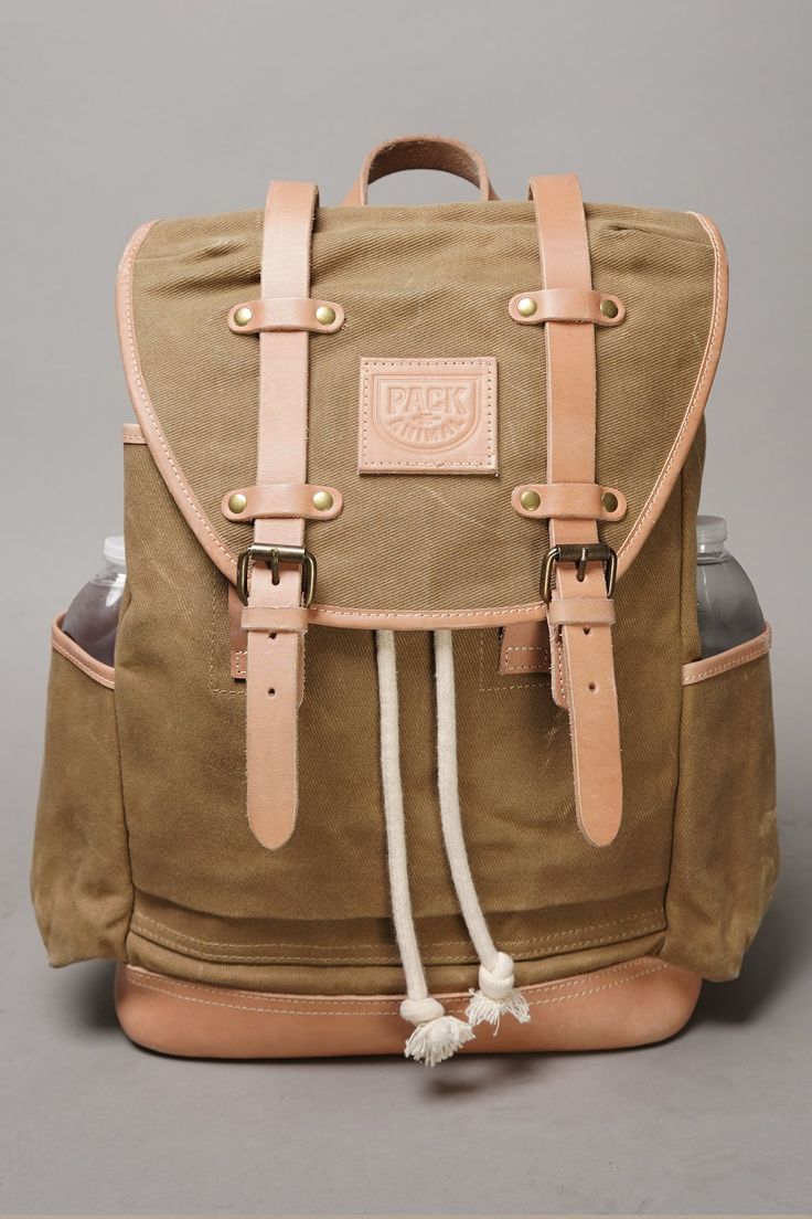 After a successful Kickstarter debut, this pack is now available for order. Classic and beautifully simple, the Extra Mile Backpack is a heritage quality everyday bag, with a touch of contemporary design. After thousands of miles of riding, countless commutes, and more trips than we can remember—we are proud to offer a pack you can count on for years of service. It's in the details: This heavy duty, waxed canvas pack features a drawstring opening and cover flap to keep everything you need inside Classic Backpack With Leather Handles For Daily Use, Classic Outdoor Satchel Backpack, Classic Satchel Backpack For Outdoor, Classic Backpack With Leather Handles, Classic Everyday Backpack With Leather Handles, Classic Leather Backpack With Leather Backing For Outdoor, Classic Outdoor Leather Backpack, Rectangular Coated Canvas Leather Backpack For Daily Use, Classic Leather Backpack For Outdoor