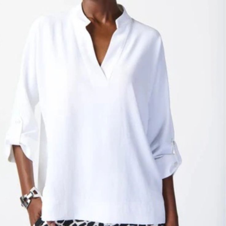 Calvin Klein Relaxed Fit Blouse Is Sure To Become A Staple In Your Closet; Pull-On Style That You Can Wear For A Night Out, Or As Part Of Your Daily Outfit. This Style Can Be Worn From Spring Into Summer Or Layered Under A Sweater Or Blazer When The Weather Cools. Condition: New With Tags. Color: White Size: Medium Fabric: 100% Polyester. Approx. Measurements: Bust: 25" Sleeve: 16” Length 26 All Measurements Are Taken From Side To Side, Unstretched And Flat Position. From Pet-Free, Smoke-Free Ho Versatile Oversized V-neck Blouse, Oversized Versatile V-neck Blouse, Chic Split Neck Blouse For Vacation, Chic Split Neck Top For Vacation, Versatile Batwing Sleeve Workwear Tops, Versatile Batwing Sleeve Tops For Workwear, Fall Vacation Blouse With Split Neck, Chic Oversized V-neck Shirt, Fall Vacation Split Neck Blouse