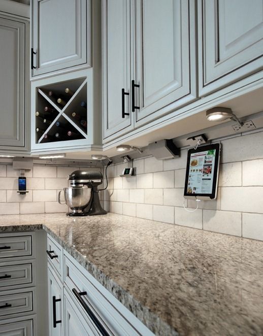 an image of a kitchen with white cabinets and granite counter tops on the website page