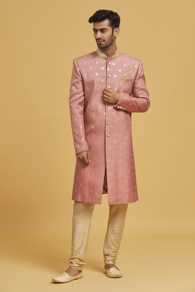 Rose pink silk sherwani with floral motifs applique embroidery. Comes with beige cotton silk churidar and a pocket scarf.
Components: 3
Pattern: Applique embroidered
Type Of Work: Floral motifs
Neckline: Mandarin collar
Sleeve Type: Full
Fabric: Cotton silk, Sherwani: Silk
Color: Pink
Other Details: 
Closure:
Sherwani: Pearl buttons
Churidar: Drawstrings
Occasion: Wedding - Aza Fashions Pink Straight Kurta Bandhgala For Festivals, Pink Bandhgala Straight Kurta For Festivals, Fitted Pink Sherwani With Pallu, Pink Bandhgala Straight Kurta For Wedding, Luxury Pink Sherwani For Diwali, Pink Bandhgala With Chikankari Embroidery For Transitional Season, Fitted Pink Sherwani With Cutdana, Pink Designer Bandhgala For Transitional Season, Pink Unstitched Bandhgala For Festivals