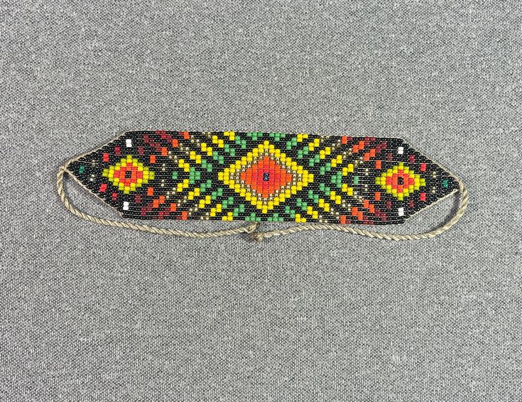 This beautiful beaded necklace is hand-woven by the women of the Embera Chami Indigenous Tribe of Colombia Bohemian Rectangular Beaded Necklaces For Festivals, Bohemian Rectangular Beaded Necklace, Bohemian Rectangular Beaded Necklaces, Southwestern Handwoven Beaded Necklaces For Festivals, Adjustable Traditional Beaded Necklaces For Festivals, Bohemian Multicolor Rectangular Beaded Necklaces, Multicolor Rectangular Bohemian Beaded Necklaces, Southwestern Style Beaded Necklace For Festivals, Multicolor Rectangular Beaded Necklace For Festivals