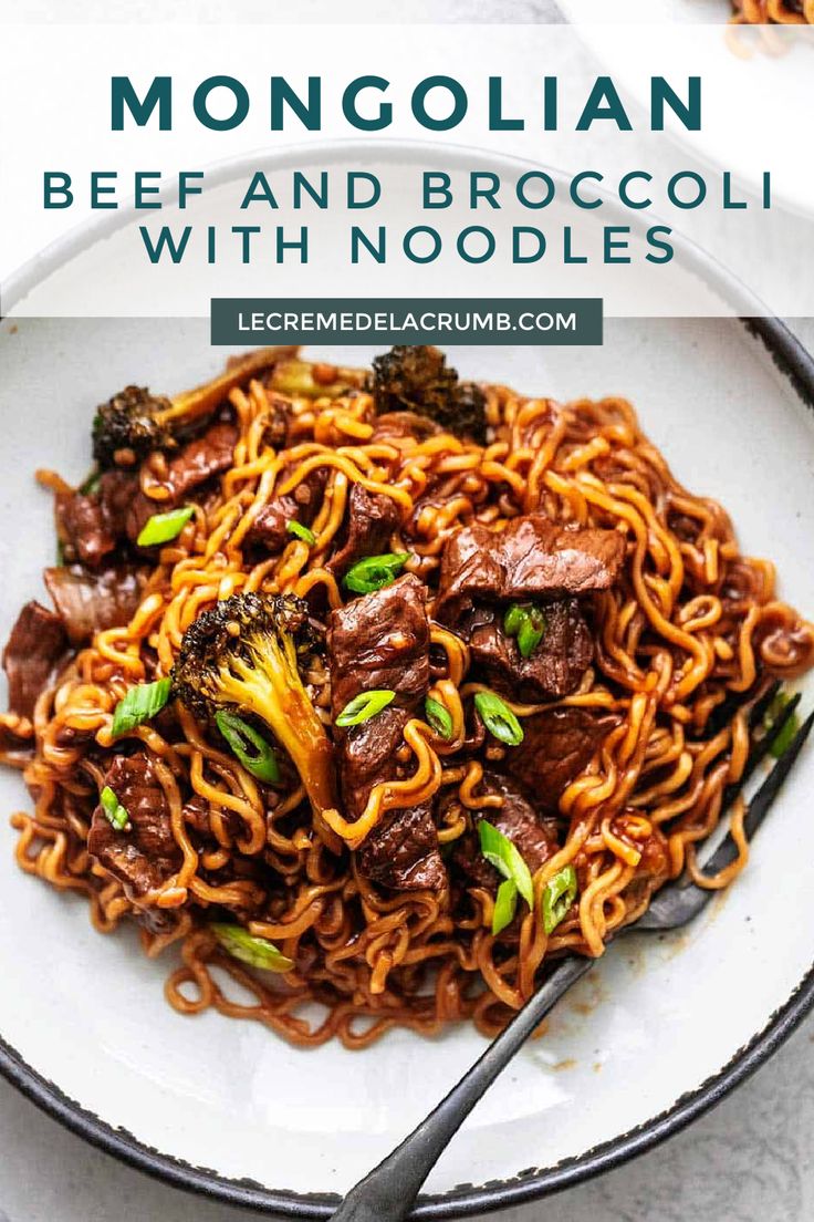 beef and broccoli with noodles in a white bowl on top of a table