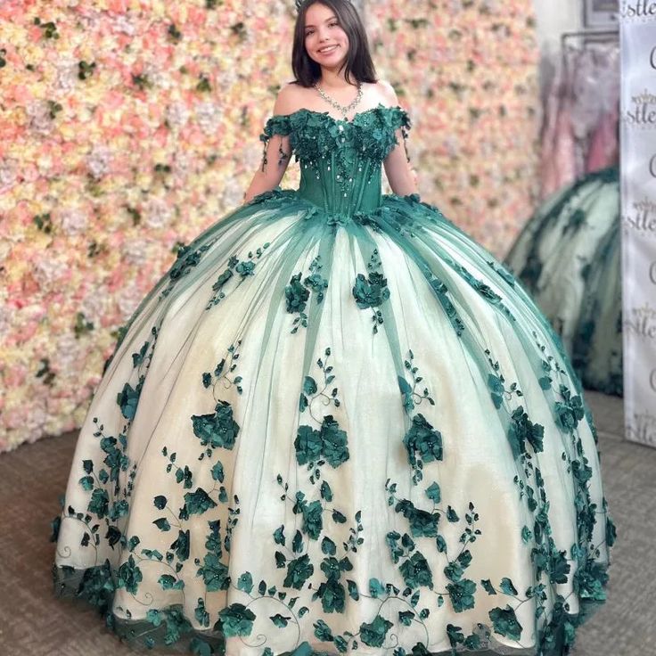 Introducing our stunning 3D Flowers Off Shoulder Tulle Appliques Beaded Pageant Quinceanera Dress. This beautiful dress is crafted from lush green tulle fabric, featuring an elegant off-the-shoulder neckline and sleeveless design. Adorned with intricate appliques and delicate beadwork, it includes a dramatic chapel train and elegant half lace-up and half zipper back. Perfect for a memorable quinceanera celebration, blending grace and glamour effortlessly. Details: Silhouette: Ball-Gown Style Fab Green Fitted Ball Gown Quinceanera Dress, Fitted Green Ball Gown Quinceanera Dress, Fitted Green Quinceanera Dress For Debutante Ball, Green Evening Dress For Quinceanera And Prom Season, Green Floor-length Dress For Quinceanera, Green Ball Gown Quinceanera Dress For Prom Season, Green Ball Gown For Prom Season Quinceanera, Fitted Green Tulle Quinceanera Dress, Green Ball Gown For Quinceanera