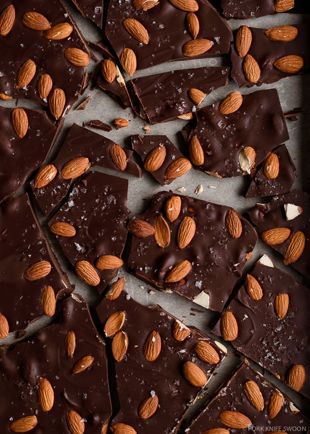 almonds and chocolate are arranged on top of each other