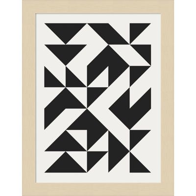 a black and white geometric design in a wooden frame