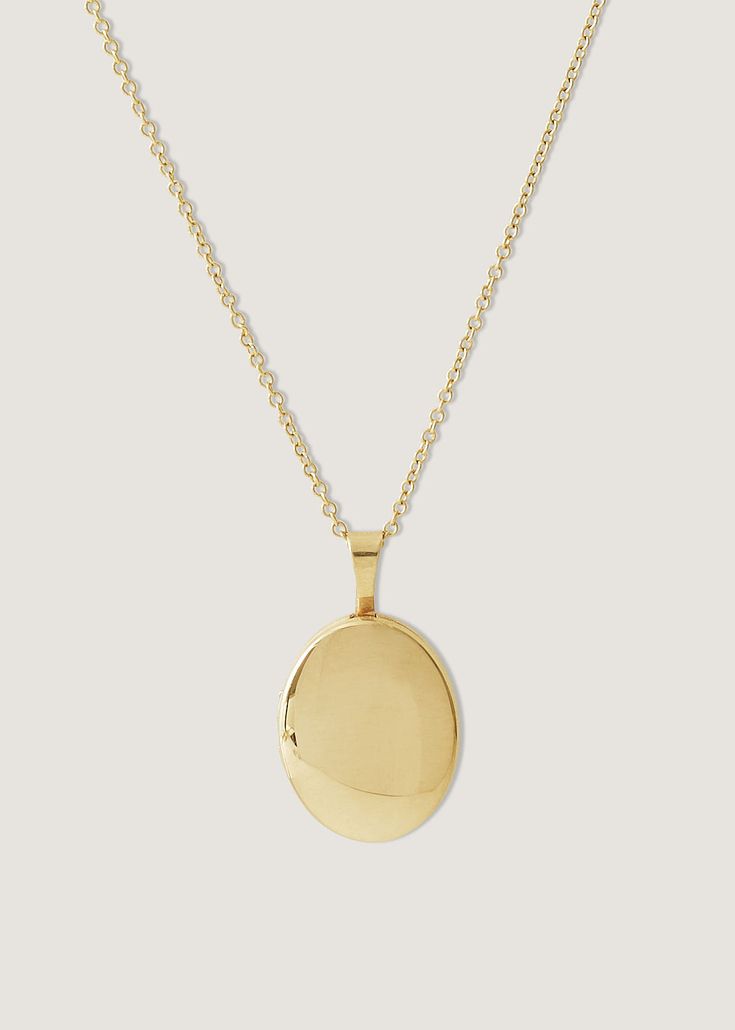 Home is where the heart is. Our Maison Gold Lockets are heirlooms that represent a moment in time. Keep this locket as a family heirloom forever.Wear her blank or get her engraved with your signature letter. To engrave more than one letter, visit HERE. Photo dimensions: 12mm x 10mmTo add a photo inside, simply open the locket and carefully press the photo into place. Our lockets do not have a separate opening for a photo. Zoe, model in red, is wearing the 20" Rolo Chain.Madeline, model in white, Heirloom Locket Necklace With Oval Pendant For Anniversary, Timeless Oval Engraved Locket Necklace, Timeless Engraved Oval Pendant Jewelry, Timeless Engraved Oval Locket Necklace, Heirloom Oval Pendant Locket Necklace For Anniversary, Timeless Oval Keepsake Necklace, Classic Oval Pendant Jewelry With Engraving Option, Timeless Oval Locket Necklace For Gift, Heirloom Oval Pendant Locket Necklace For Memorial