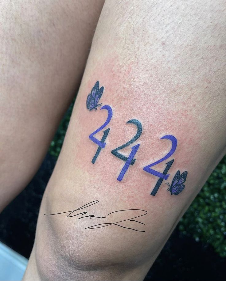 a person's legs with numbers and butterflies on them